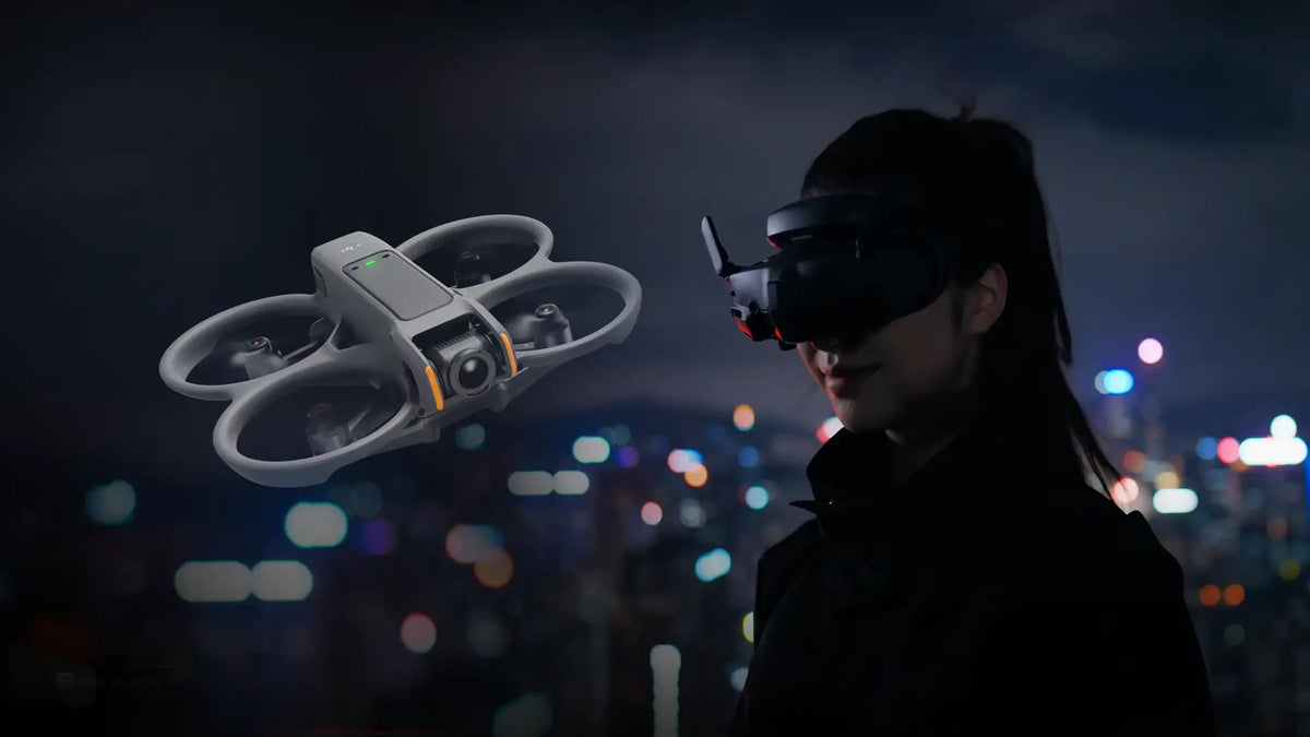 DJI Avata 2 FPV drone flying beside a pilot wearing DJI Goggles for immersive first-person flight and cinematic aerial video capture.