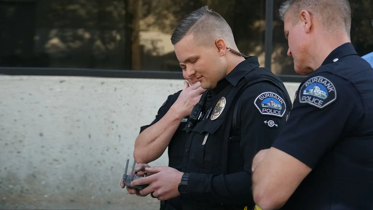 Burbank Police officers operating a drone controller during a public safety mission to support law enforcement and emergency response operations.