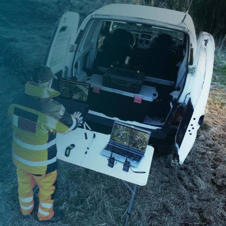 PIX4Dreact used by an emergency responder on a laptop beside a field vehicle