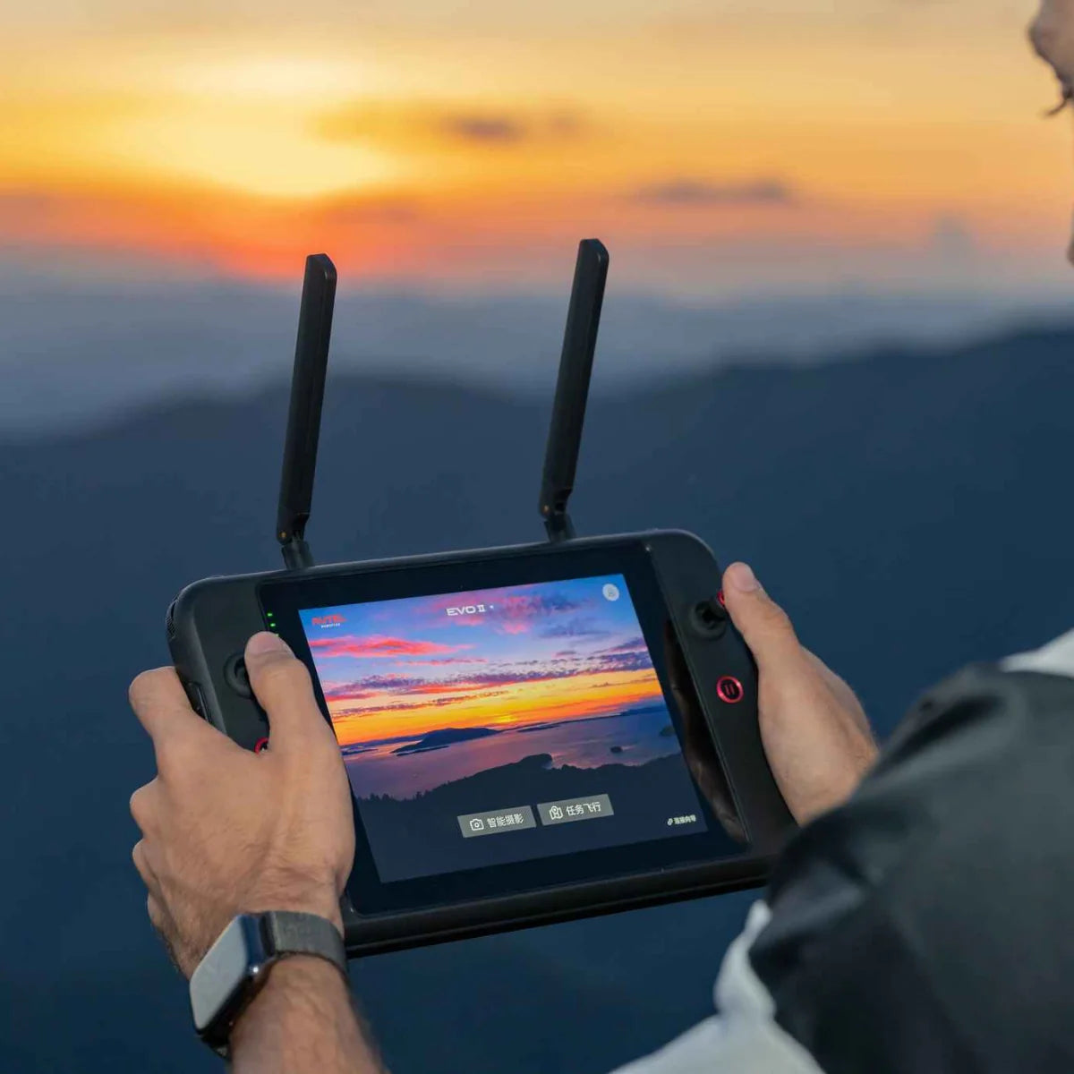 Autel 7.9-inch Smart Controller being used outdoors at sunset