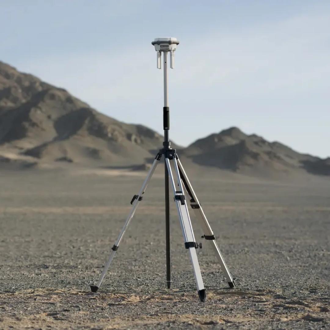 DJI D-RTK 3 survey pole and tripod shown collapsed for transport