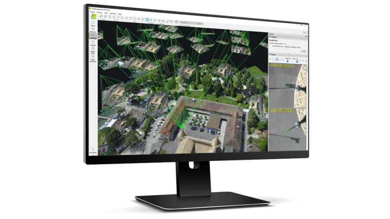 PIX4Dmapper photogrammetry project displayed as a 3D reconstruction on a desktop monitor