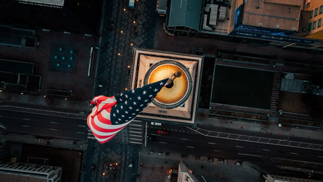 Aerial view of an American flag representing FAA Remote ID compliance, U.S. drone regulations, and the evolving drone industry.