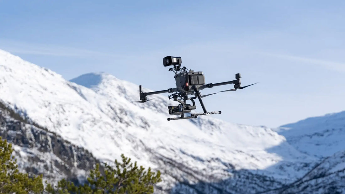 DJI FlyCart 30 flying in mountainous terrain showcasing long-range flight capabilities for cargo delivery and enterprise operations.