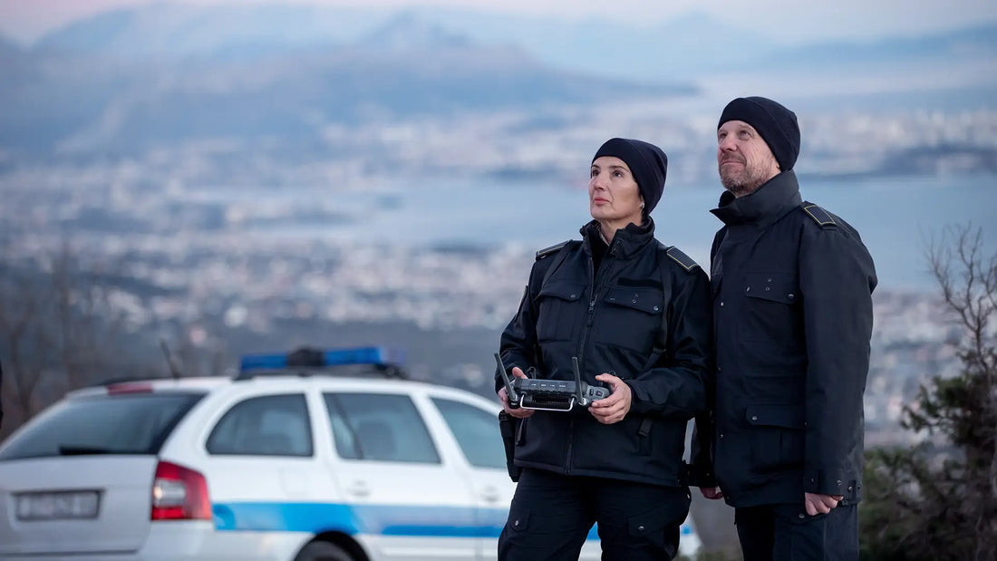Law enforcement officers operating a police drone during a public safety mission to improve situational awareness and emergency response.