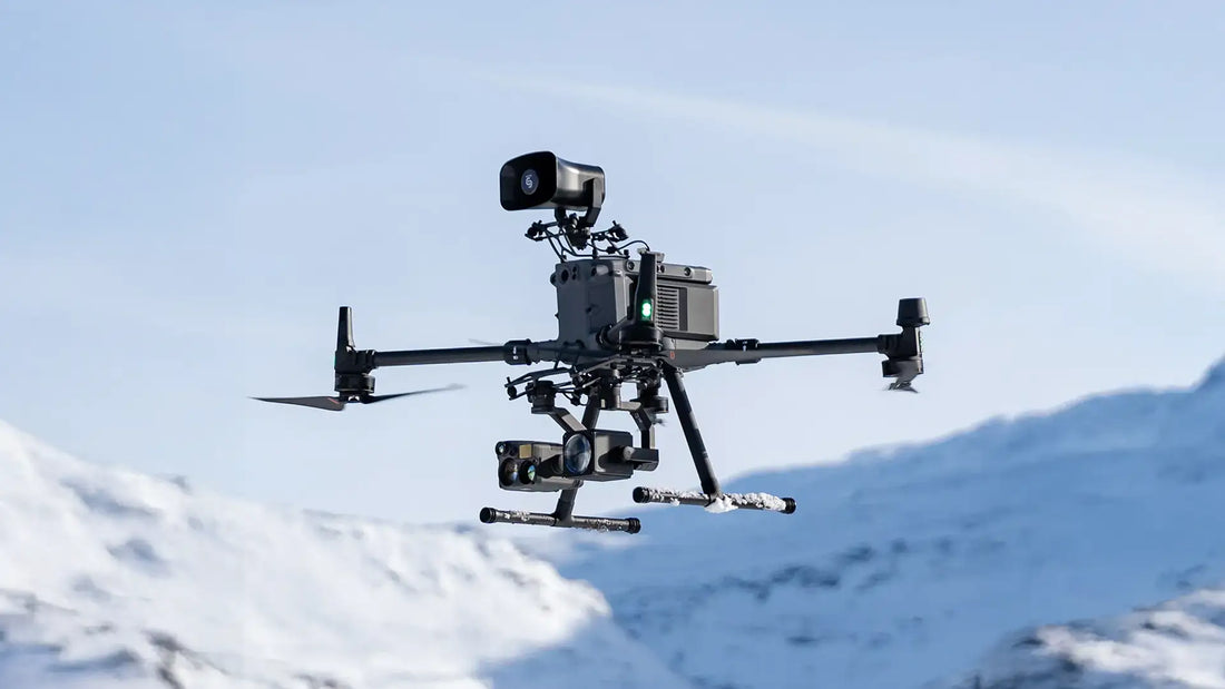 DJI Matrice 350 RTK equipped with emergency response payloads including thermal imaging, zoom camera, and spotlight for search and rescue missions.
