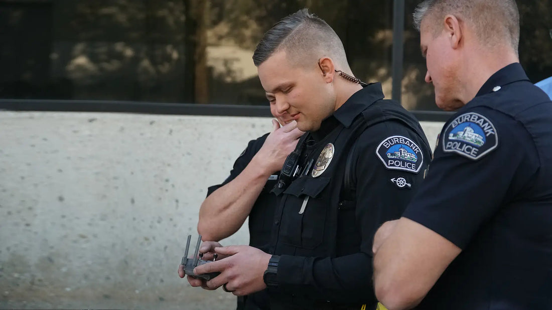 Burbank Police officers operating a drone controller during a public safety mission to support law enforcement and emergency response operations.