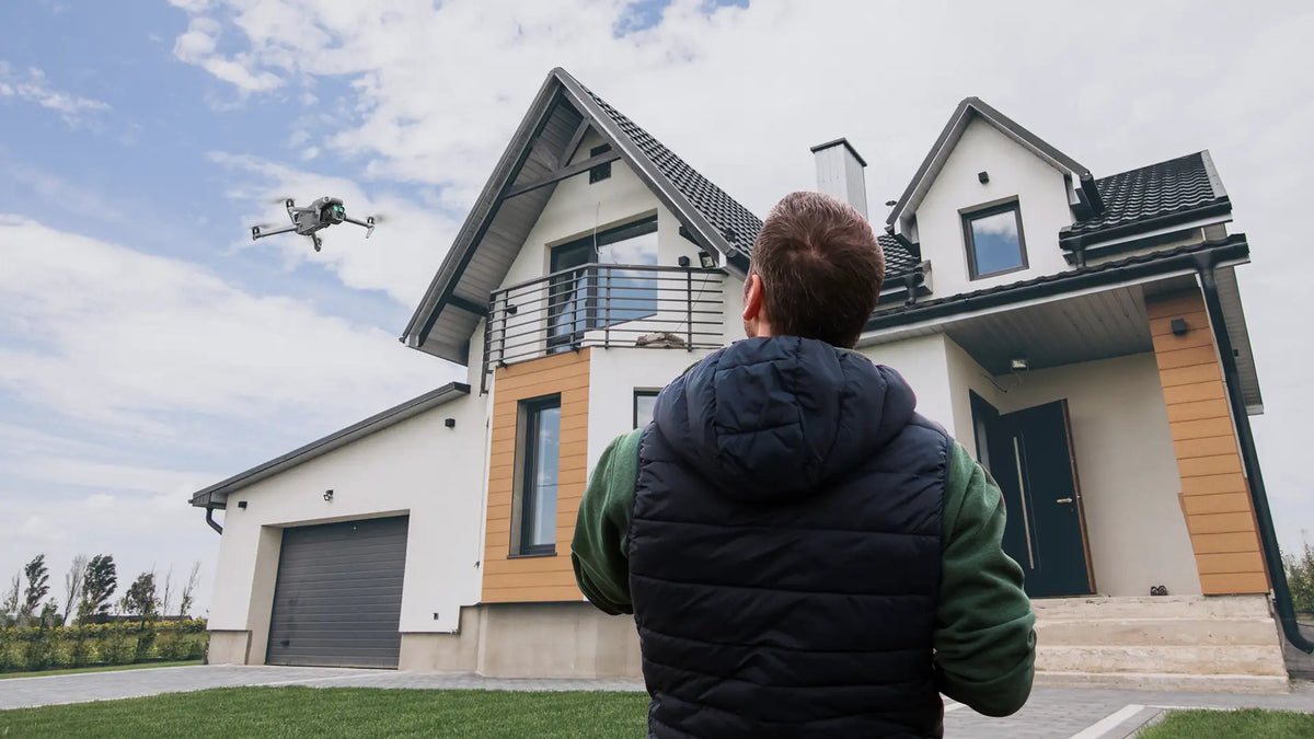 Homeowner observing a drone flying near a residential property, illustrating drone privacy laws, personal space, and responsible drone operations.