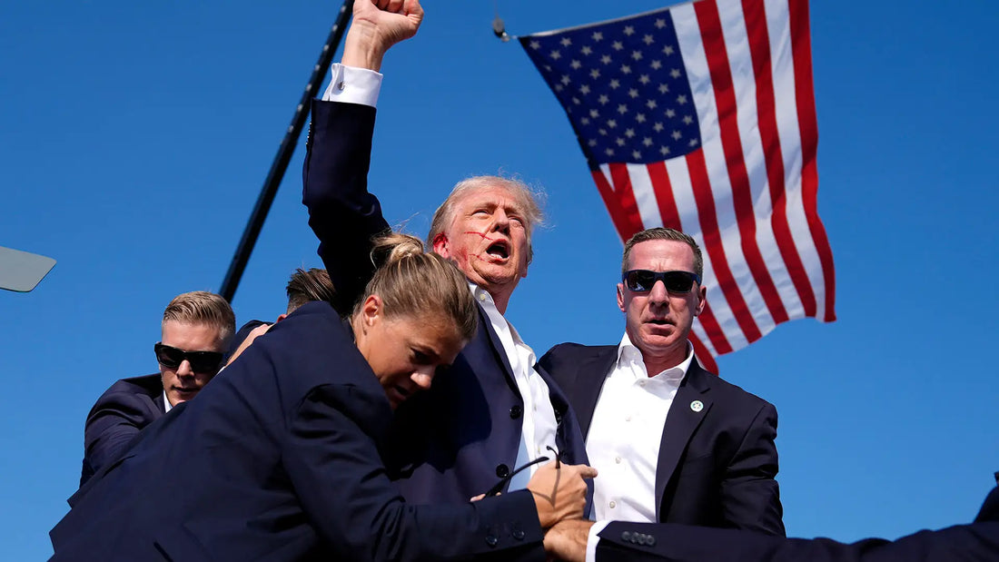 Donald Trump surrounded by Secret Service agents moments after the attempted assassination during a campaign rally in Butler, Pennsylvania.