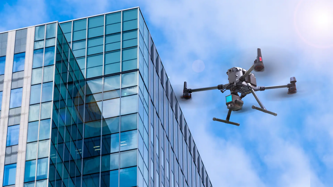 Enterprise drone inspecting a commercial building facade to identify structural defects, facade damage, and maintenance issues during a safe aerial inspection.