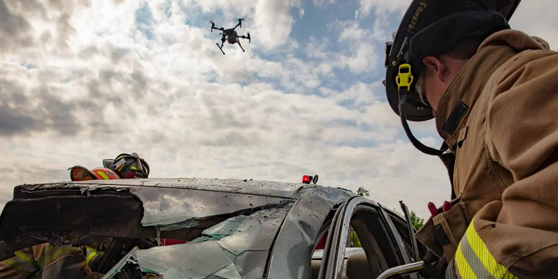 Firefighters using an enterprise drone over a vehicle rescue scene to provide thermal imaging, aerial situational awareness, emergency response support, firefighting operations, and public safety incident assessment.