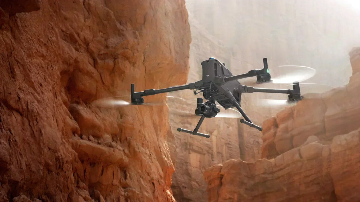 DJI Matrice 400 hovering over a deep, remote canyon in the wilderness.