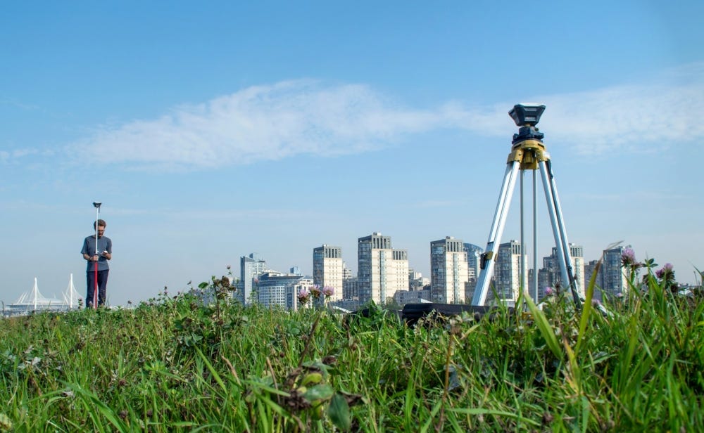 Drone performing cadastral surveying and land management with high-accuracy aerial mapping, property boundary identification, GIS data collection, and surveying workflows.