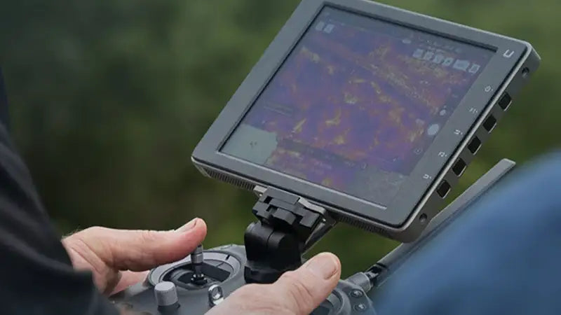 Close-up of thermal imagery displayed on a drone controller during public safety training