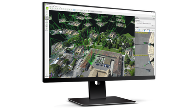 PIX4Dmapper photogrammetry project displayed as a 3D reconstruction on a desktop monitor