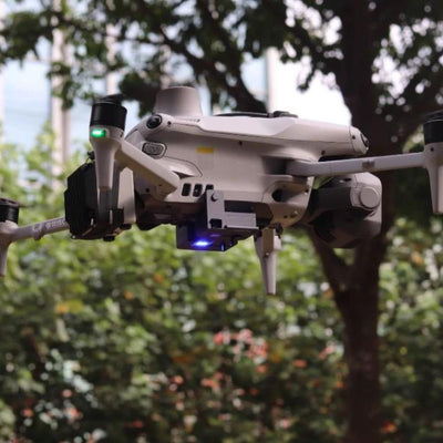 DSLRPros Air Drop System mounted beneath a DJI Matrice 4 drone during flight
