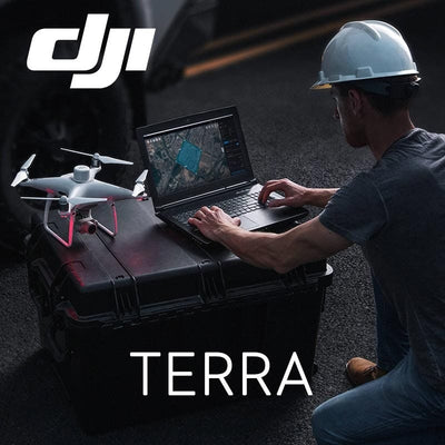 Technician using DJI Terra on a laptop beside a survey drone