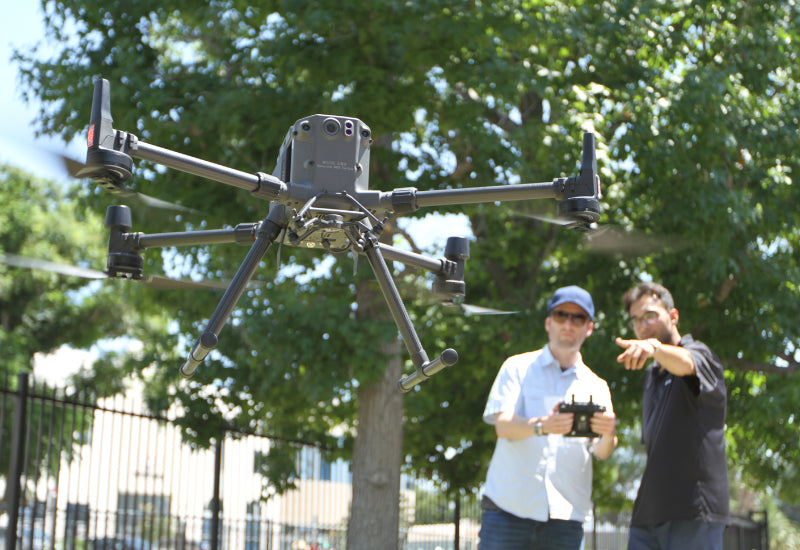 DSLRPros drone training with a man doing a demo of how to fly a DJI drone.